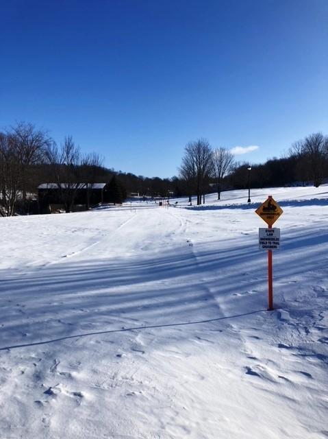 A snowmobile trail with signage