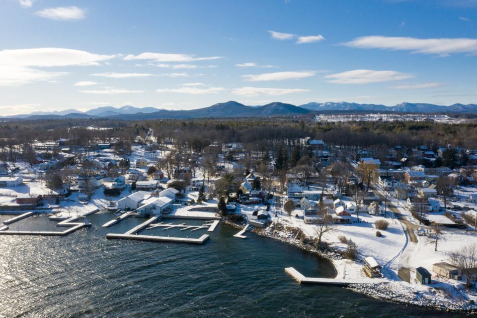 A town covered in snow on the shores of Lake Champlain.