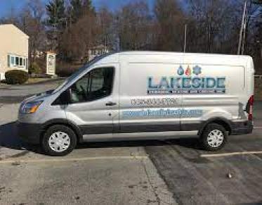 A white sprinter van with Lakeside Plumbing and Heating on the side.