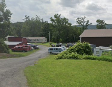 Cars out front of Tromblee Towing and Auto Repair.
