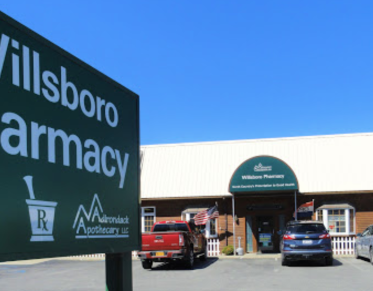 The front of Willsboro Pharmacy and entry sign.