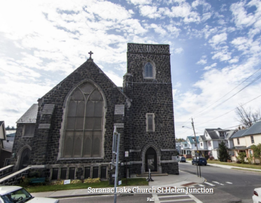 Exterior of the tall grey stone church