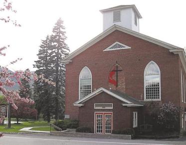 Brick exterior of the front entrance of the church