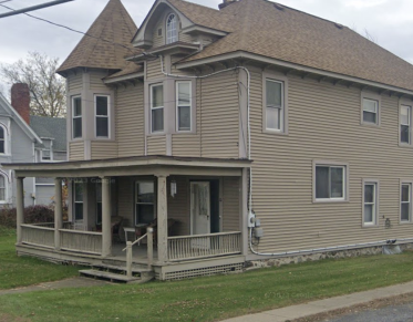 Brown Vinyl exterior of a church outbuilding