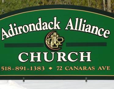 Green sign for the adirondack alliance church