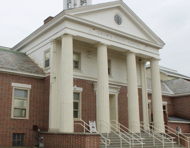 Tall white columns create a grand entry to the Crown Point School