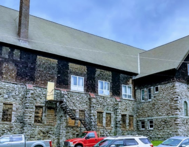 A stacked stone building.