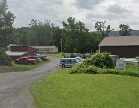 Cars out front of Tromblee Towing and Auto Repair.