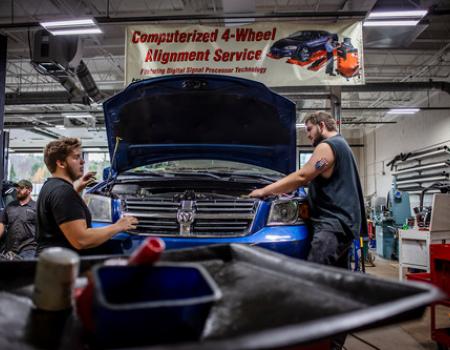 Students work on cars