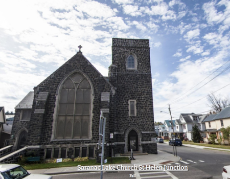 Exterior of the tall grey stone church