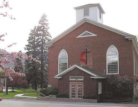 Brick exterior of the front entrance of the church