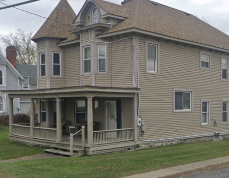 Brown Vinyl exterior of a church outbuilding