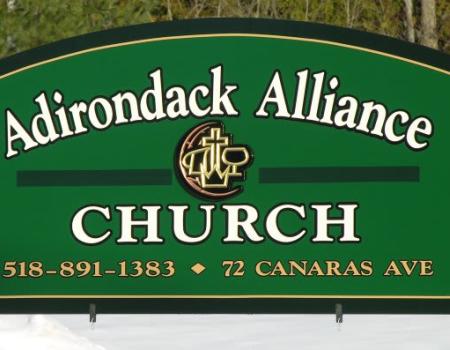Green sign for the adirondack alliance church