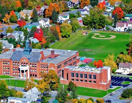 Areal view of the brick school and athletic fields behind
