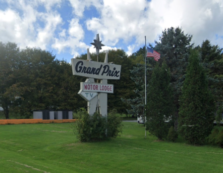 The sign for the Grand Prix Motor Lodge