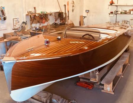 Finishing touches are put on the restoration of a beautiful wooden boat