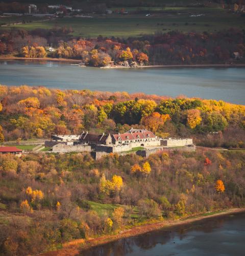 A star shaped fort off of the lake in fall. 