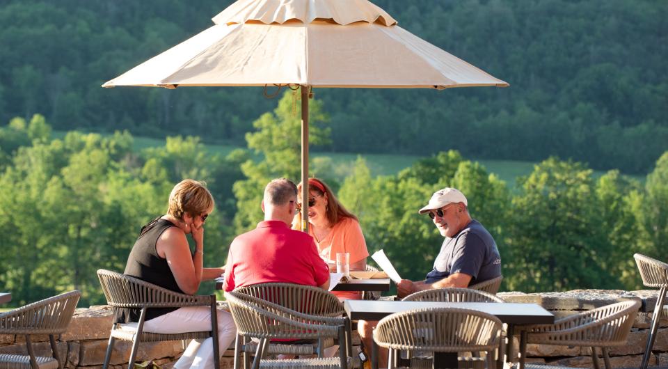 table of 4 diners on the terrace at ticonderoga golf course 