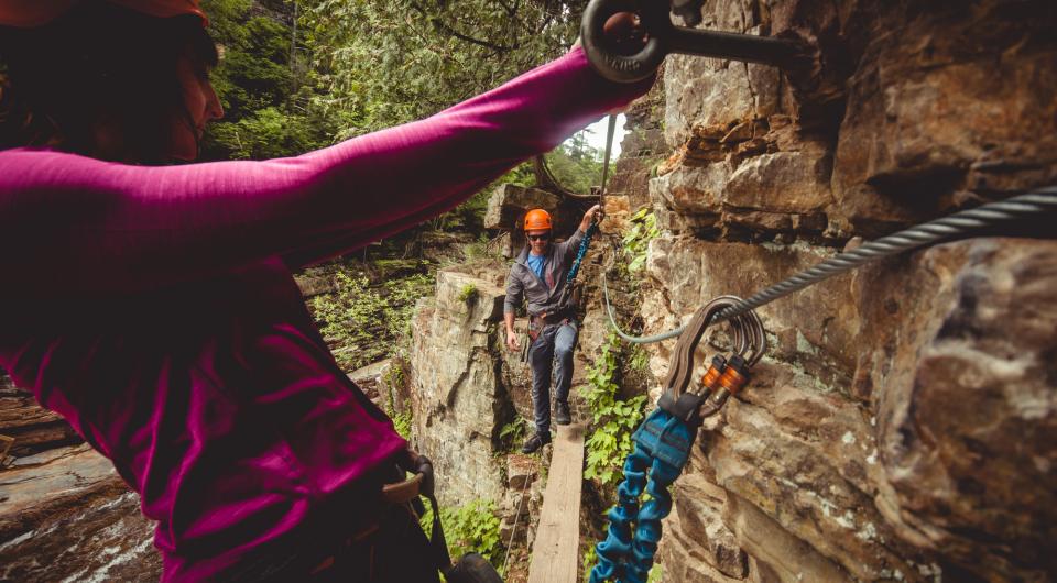 Experience the chasm from above harnessed to cables and walking wooden planks