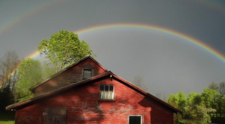 rainbow over a red barn