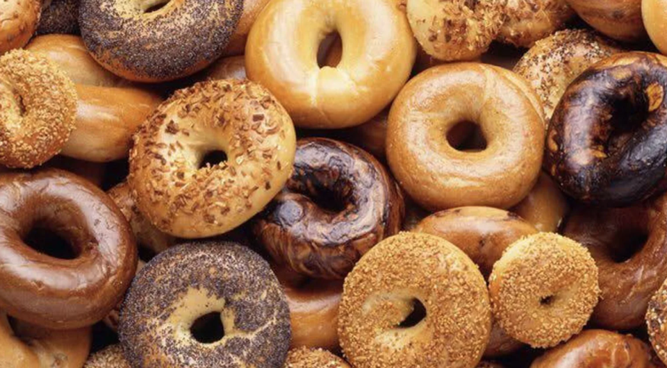 Bagels of various types in a delicious pile.