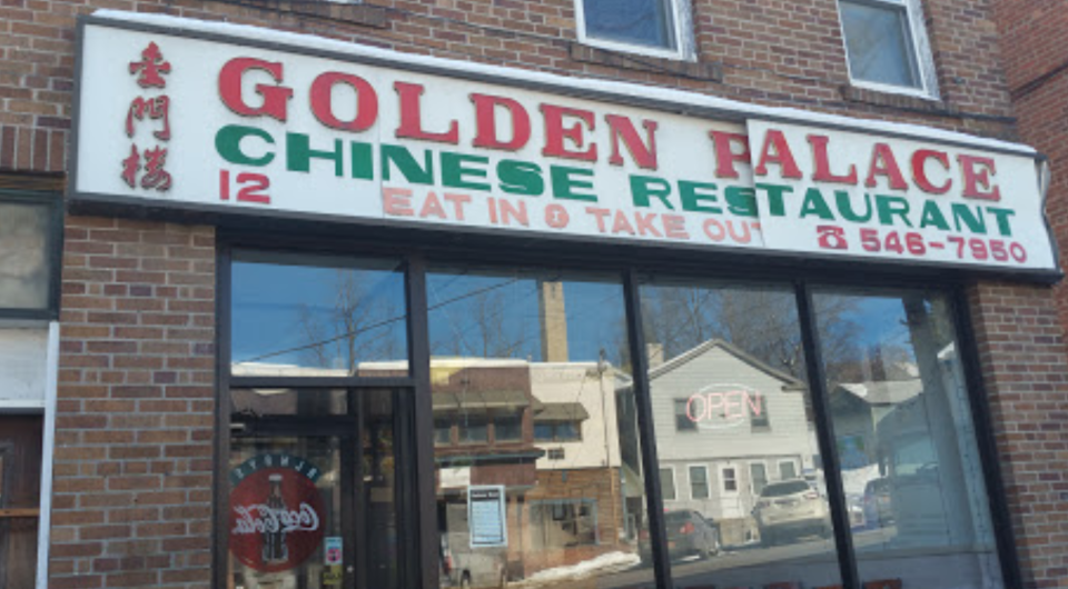 A large white sign above the window reading Golden Palace Chinese Restaurant.