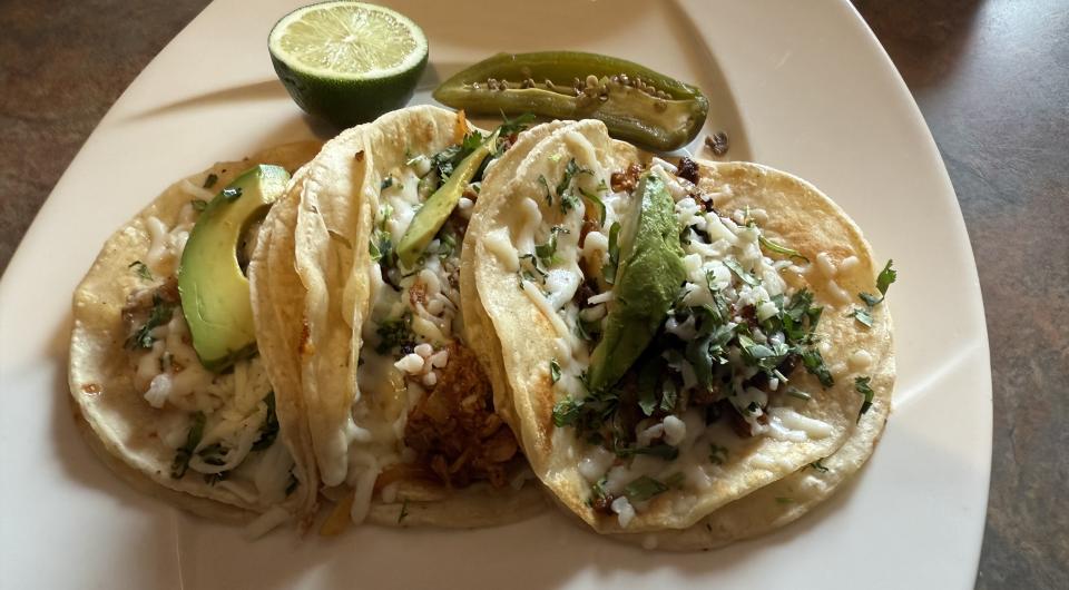 A plate of tacos with assorted meat choices.