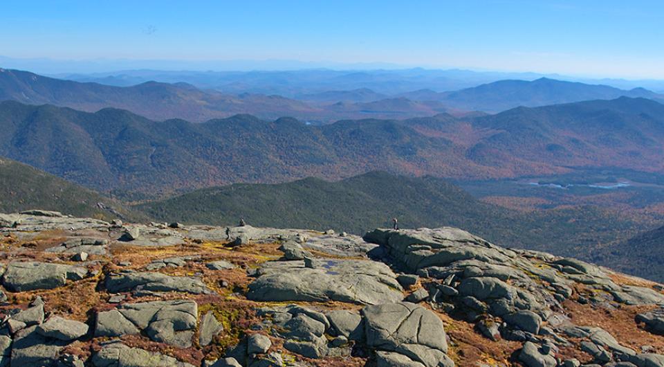 The rocky peak of a mountain looking out over the horizon.