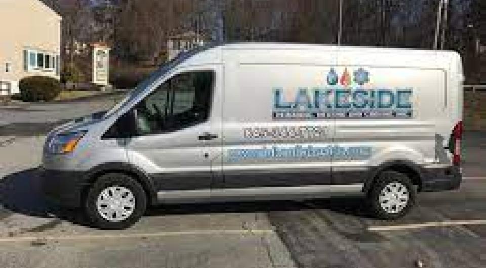 A white sprinter van with Lakeside Plumbing and Heating on the side.