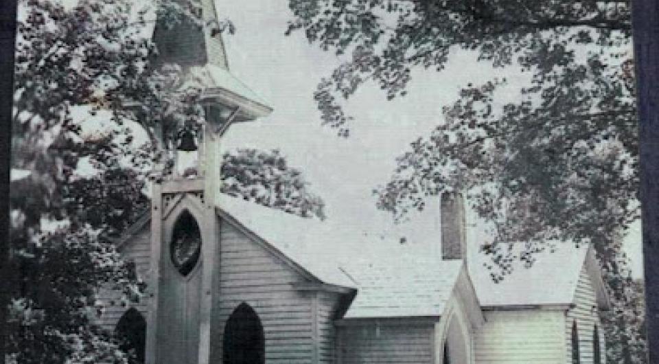 A black and white photo of St Johns Church from yester-year