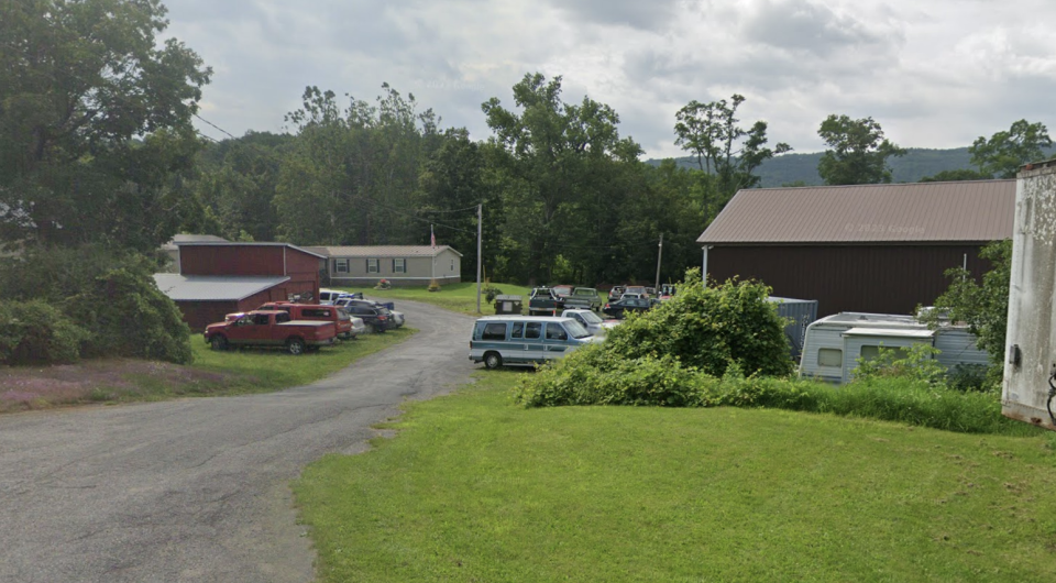 Cars out front of Tromblee Towing and Auto Repair.