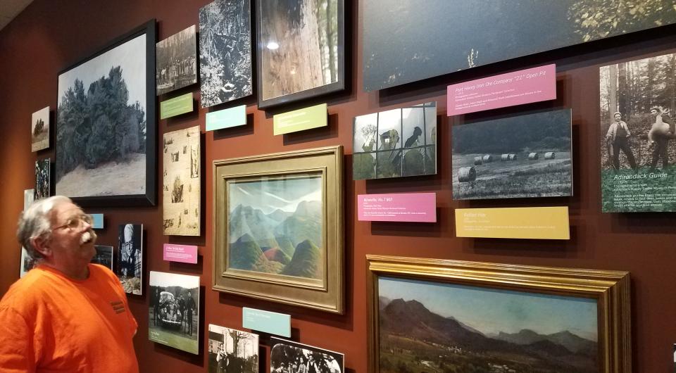 Images with description cards hung on walls.