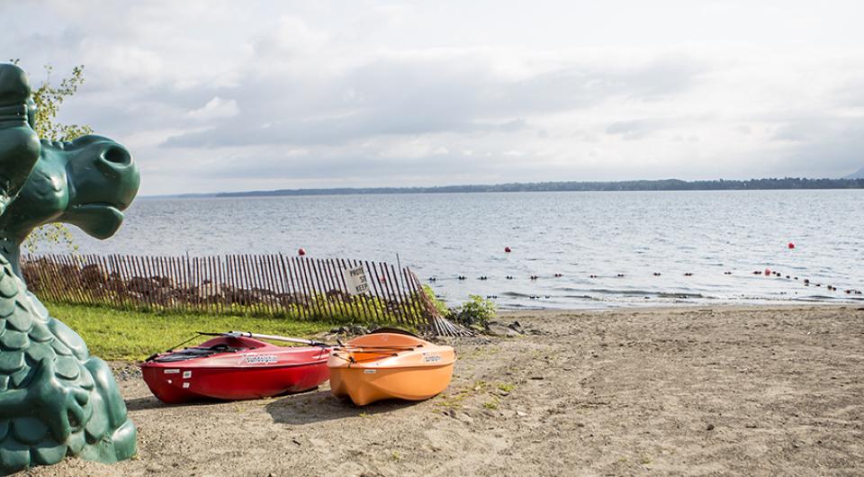 kayakers on beach near champ figure