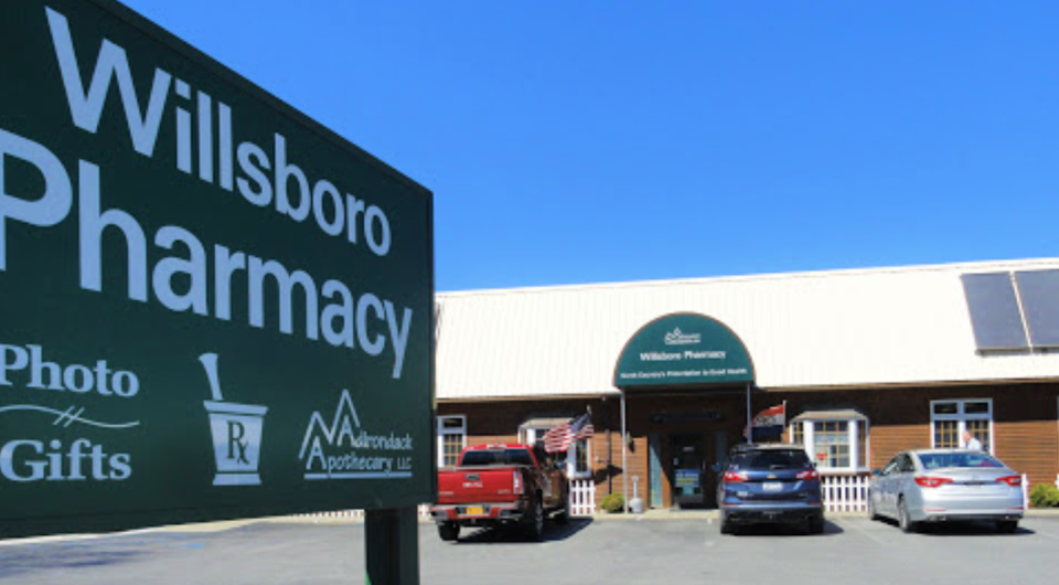 The front of Willsboro Pharmacy and entry sign.
