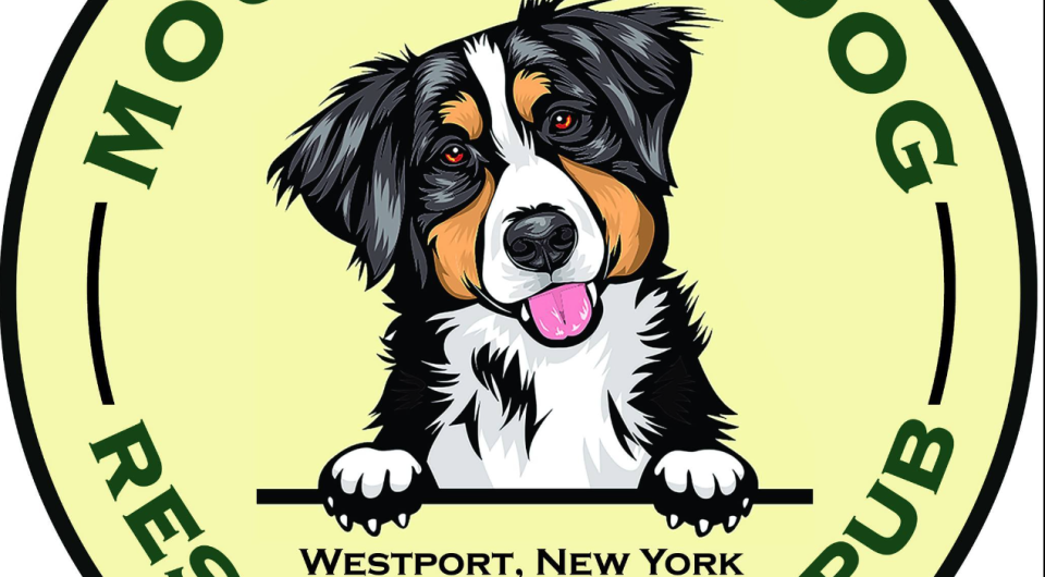 A logo badge for Mountain Dog Restaurant & Pub with an illustration of a Bernese mountain dog in the center.