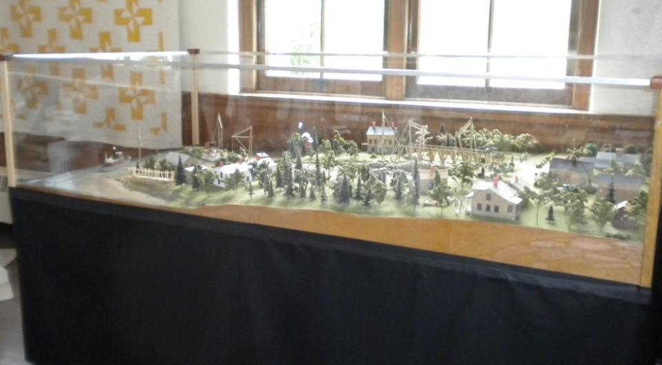 A model of a historical representation of Willsboro under glass.