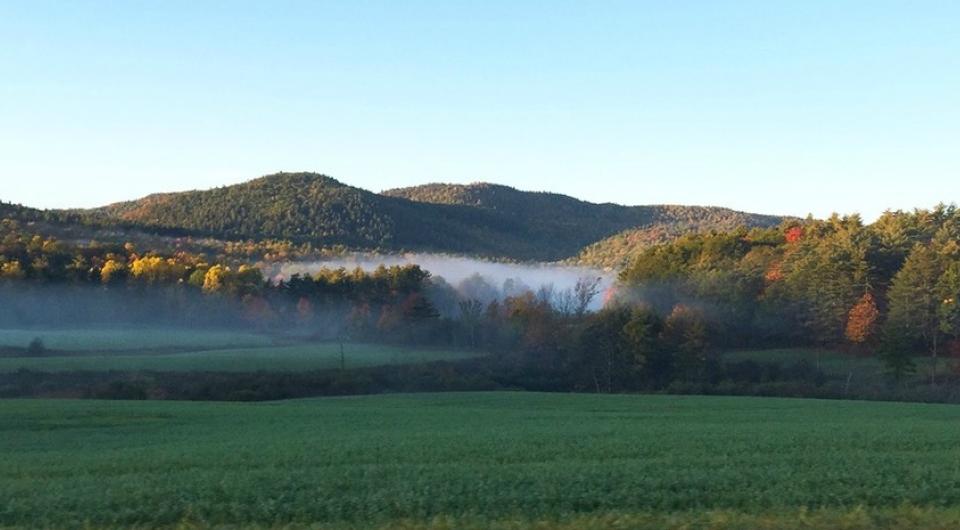 Roadside view of misty mountains