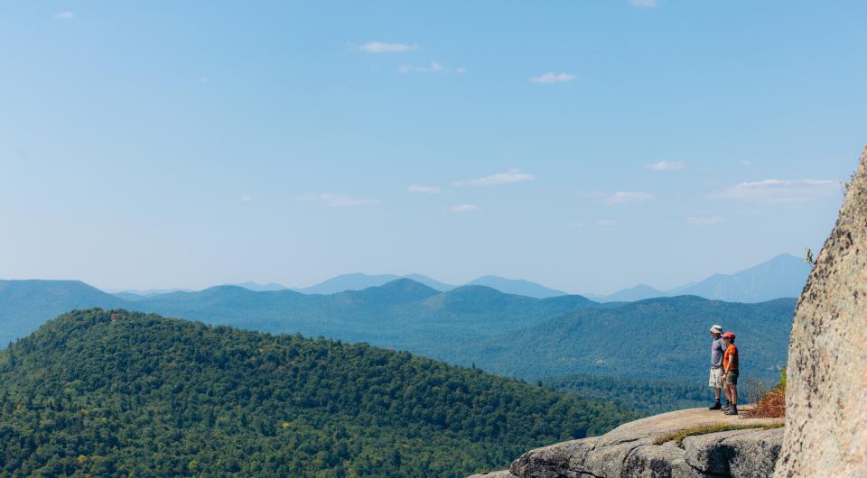 Two hikers on a broad overlook