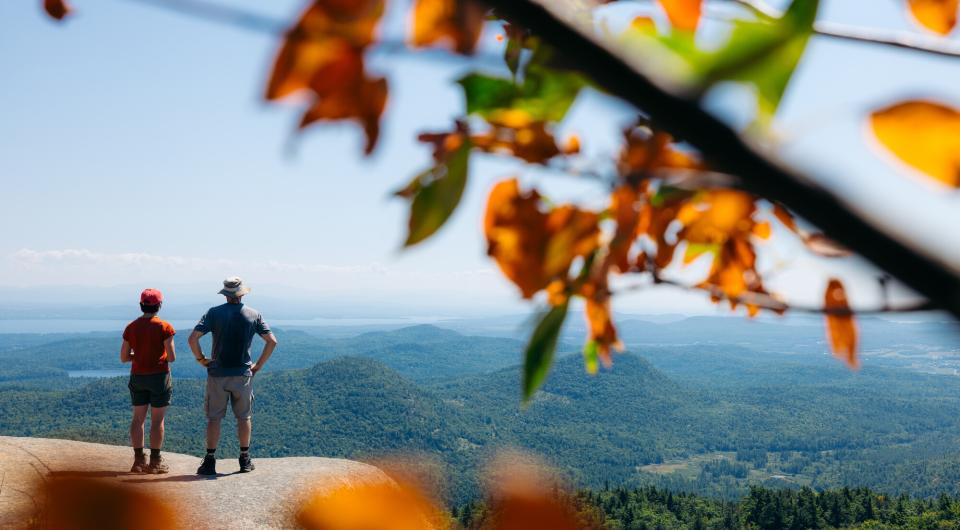Two hikers looking at the view from an overlook