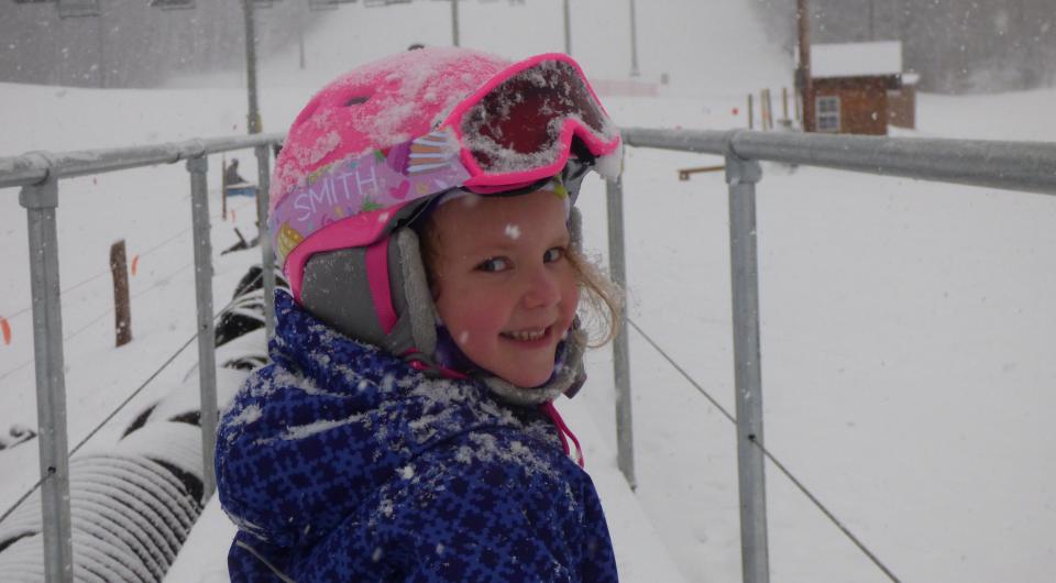 A kid at Titus Mountain on a snowy day.