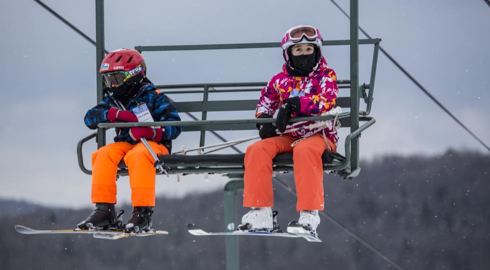 Two kids on a chair lift at Titus