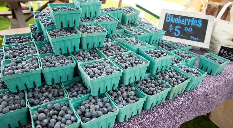 A stack of blueberry cartons