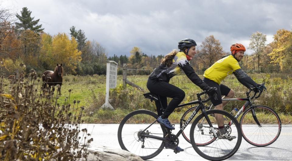 Two cyclists on a wet road