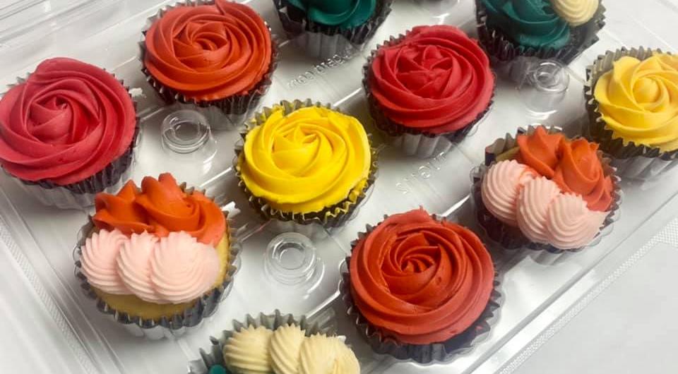 Cupcakes decorated with colorful icing shaped like flowers