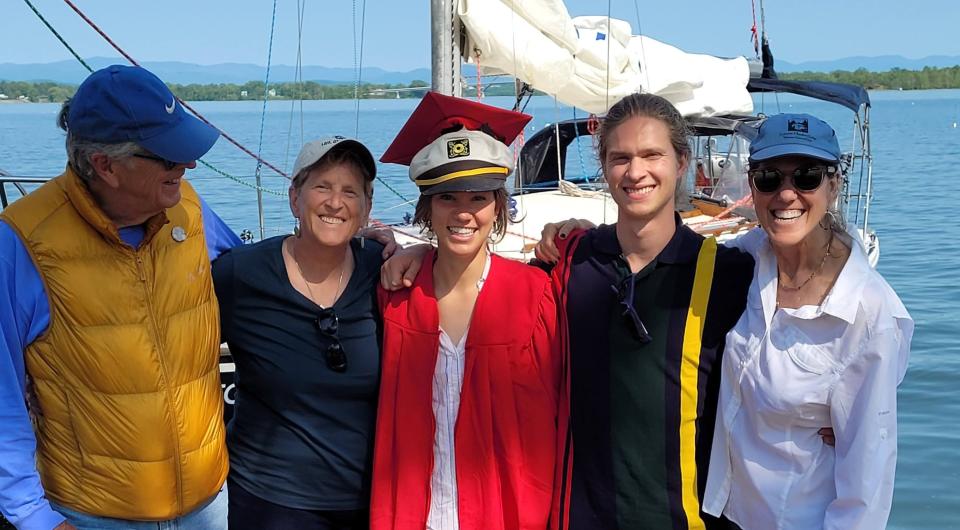 People taking a photo on a sailboat