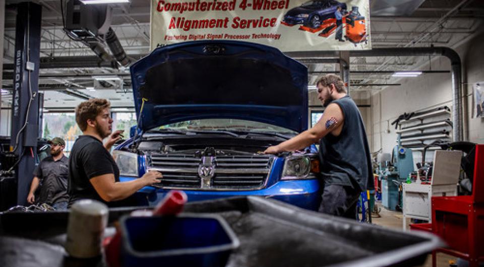 Students work on cars