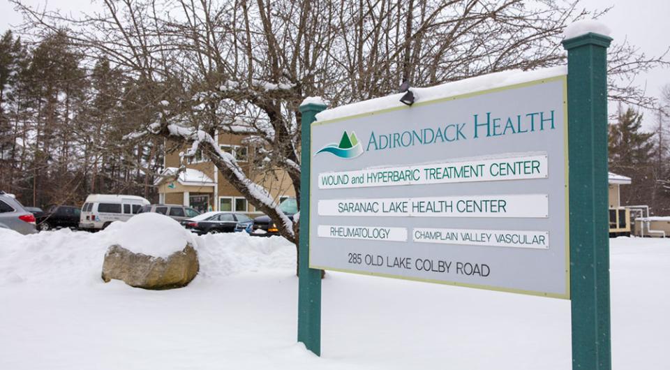 Entry sign with doctor names at the front of the Saranac Lake Health Center