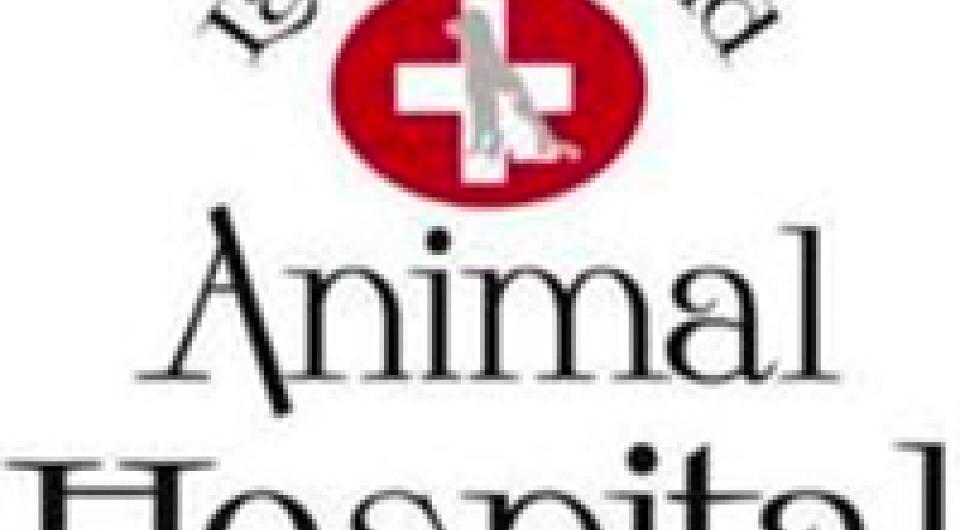 Lake Placid Animal Hospital logo of red circle with white cross and grey dog silhouette in center.