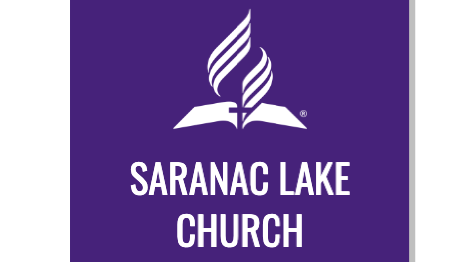 Logo for Saranac Lake Church with blue background and white lettering and an open book with flag rising from it