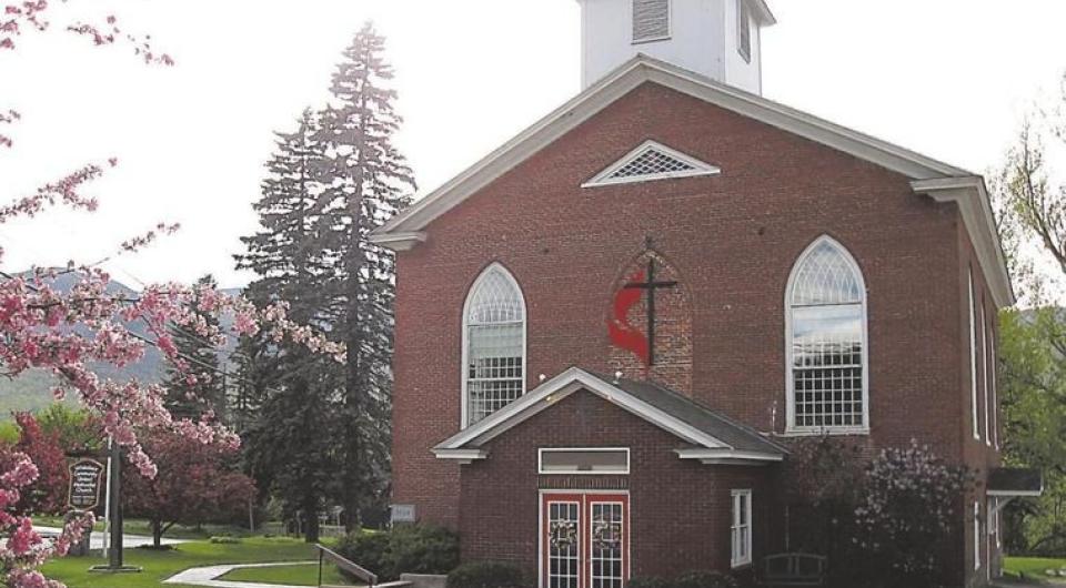 Brick exterior of the front entrance of the church